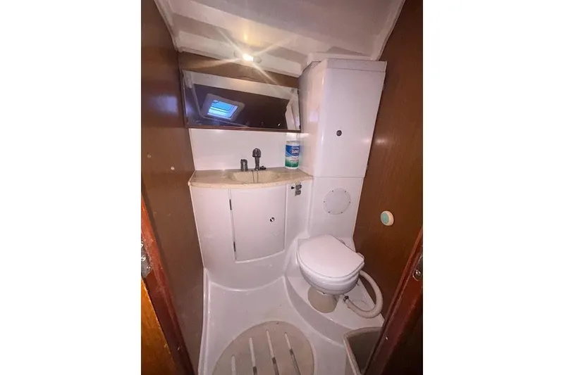 Slide: The Image of Bathroom interior of 2007 Jeanneau Sun Odyssey 42 DS yacht, featuring sink and toilet. - 14