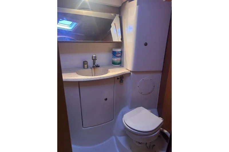 Slide: The Image of Bathroom interior of 2007 Jeanneau Sun Odyssey 42 DS yacht, featuring sink and toilet. - 15
