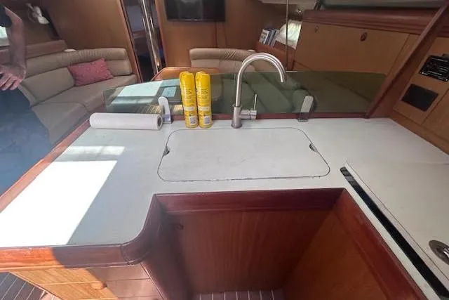 Slide: The Image of 2007 Jeanneau Sun Odyssey 42 DS yacht interior with kitchen sink and lounge area. - 18