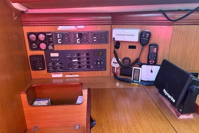 Slide: The Image of Control panel of a 2007 Jeanneau Sun Odyssey 42 DS sailboat, featuring navigation and communication equipment. - 22