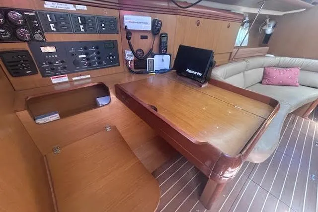 Slide: The Image of Interior of 2007 Jeanneau Sun Odyssey 42 DS yacht with navigation station and seating area. - 3