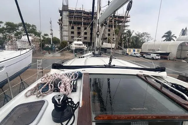 Slide: The Image of 2007 Jeanneau Sun Odyssey 42 DS sailboat docked, with ropes and winch visible on deck. - 37