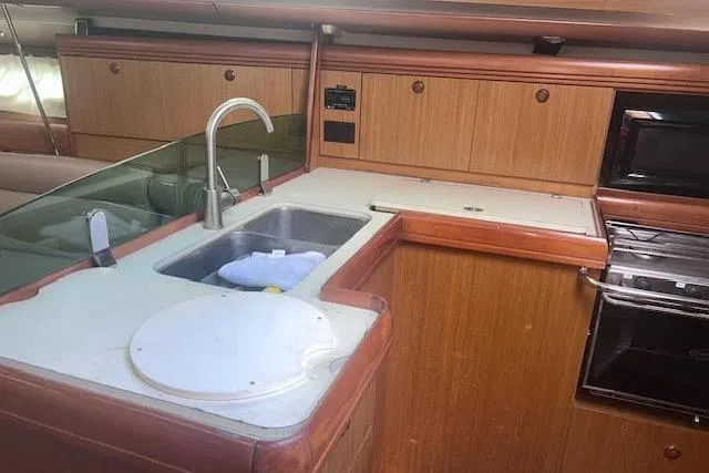 Slide: The Image of Interior view of 2007 Jeanneau Sun Odyssey 42 DS yacht kitchen area. - 43