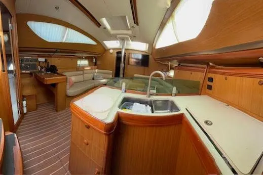 Slide: The Image of Interior of 2007 Jeanneau Sun Odyssey 42 DS yacht, featuring a spacious kitchen and seating area. - 50