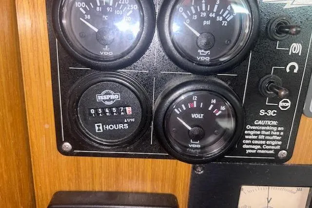 Slide: The Image of Instrument panel of a 2007 Jeanneau Sun Odyssey 42 DS sailboat, displaying gauges and warnings. - 51