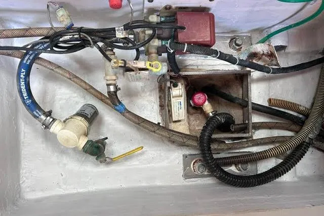Slide: The Image of Electrical and plumbing components in a 2007 Jeanneau Sun Odyssey 42 DS yacht. - 55