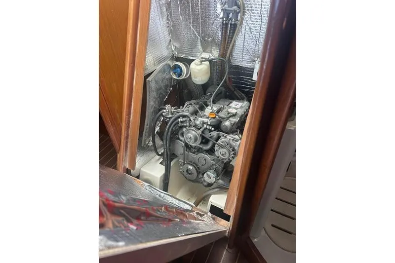 Slide: The Image of Engine compartment of 2007 Jeanneau Sun Odyssey 42 DS sailboat, showcasing mechanical components. - 57