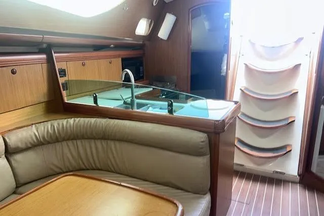 Slide: The Image of Interior of 2007 Jeanneau Sun Odyssey 42 DS yacht with cozy seating and modern kitchen. - 59
