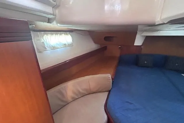 Slide: The Image of Interior cabin of 2007 Jeanneau Sun Odyssey 42 DS with cozy seating and bed. - 6