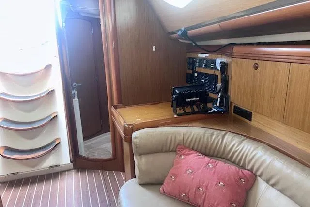 Slide: The Image of Interior of 2007 Jeanneau Sun Odyssey 42 DS yacht with navigation equipment and seating area. - 60