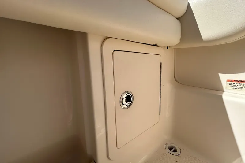 Slide: The Image of Storage compartment on a 2015 Grady-White Freedom 275 boat interior. - 10