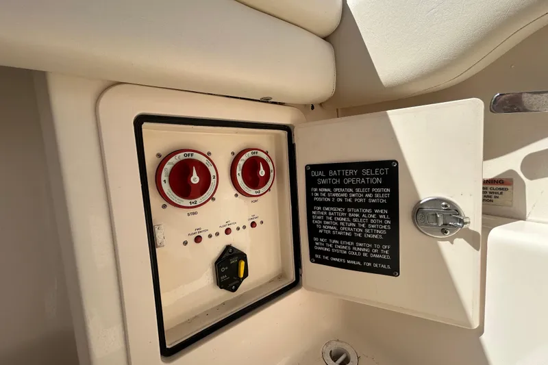 Slide: The Image of Control panel of a 2015 Grady-White Freedom 275 boat with dual battery switches. - 11