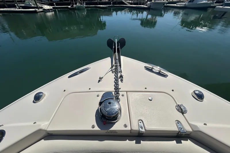Slide: The Image of Bow view of 2015 Grady-White Freedom 275 boat docked in calm marina. - 27