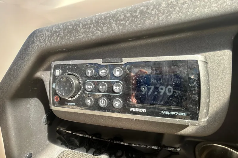 Slide: The Image of Fusion MS-IP700i radio on a 2015 Grady-White Freedom 275 boat dashboard. - 34