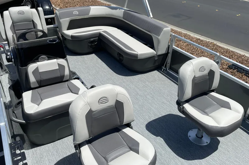 Slide: The Image of 2026 Sun Tracker Bass Buggy 16 XL Select pontoon boat interior with gray seating and carpet. - 7