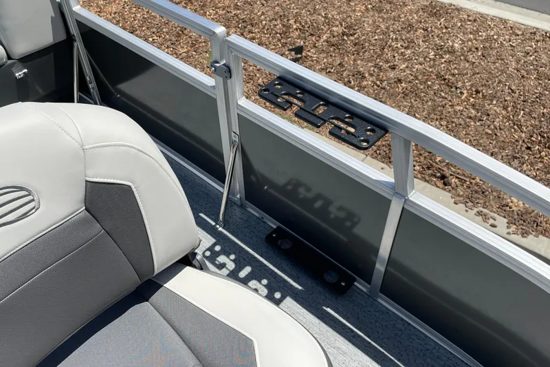 Slide: The Image of 2026 Sun Tracker Bass Buggy 16 XL Select boat interior with gray seating and railing details. - 20