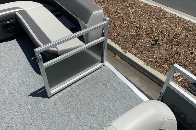 Slide: The Image of 2026 Sun Tracker Bass Buggy 16 XL Select pontoon boat interior with seating and open gate. - 21