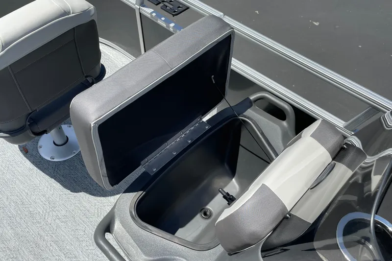 Slide: The Image of 2026 Sun Tracker Bass Buggy 16 XL Select boat interior with open storage compartment and seating. - 17