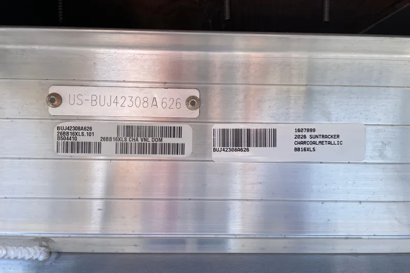 Slide: The Image of 2026 Sun Tracker Bass Buggy 16 XL Select identification plate with serial numbers and barcodes. - 98