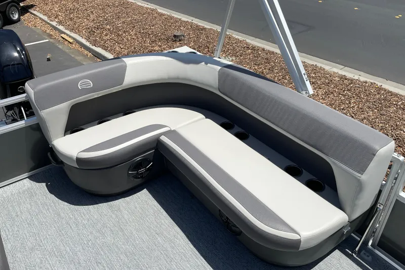 Slide: The Image of 2026 Sun Tracker Bass Buggy 16 XL Select pontoon boat seating area with cup holders. - 10