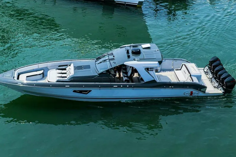 The Image of 2025 Cigarette 52' Thunder boat on water, showcasing sleek design and powerful engines. - 1