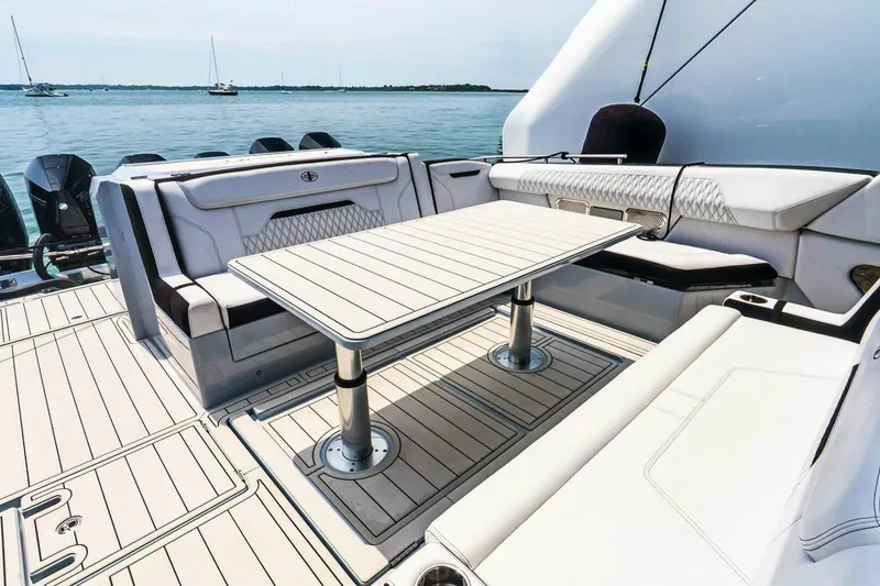 Slide: The Image of Luxurious seating area on 2025 Cigarette 52' Thunder yacht with elegant table design. - 10