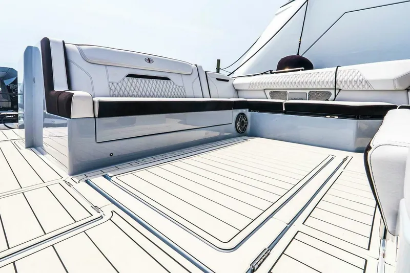 Slide: The Image of Luxurious seating on 2025 Cigarette 52' Thunder boat deck, featuring sleek design and premium materials. - 11