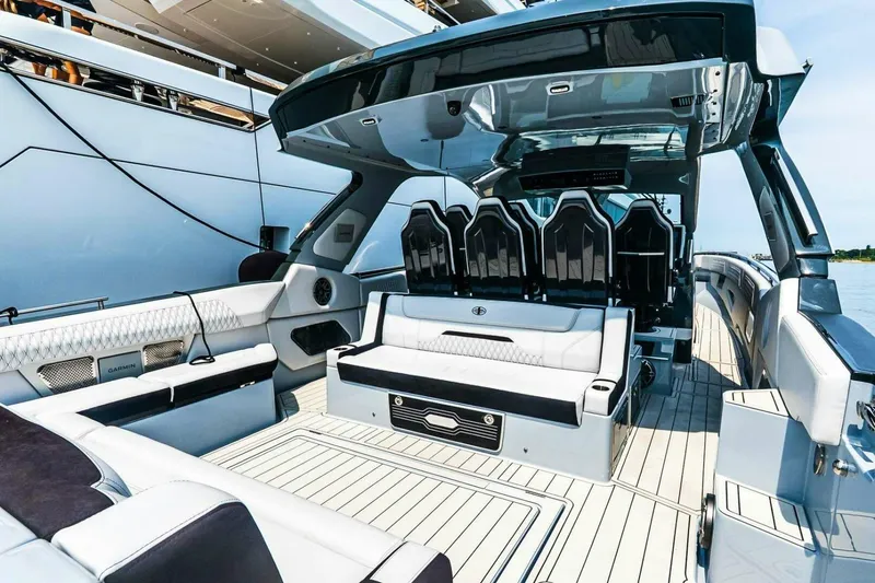 Slide: The Image of Luxurious 2025 Cigarette 52' Thunder yacht interior with sleek seating and modern design. - 12