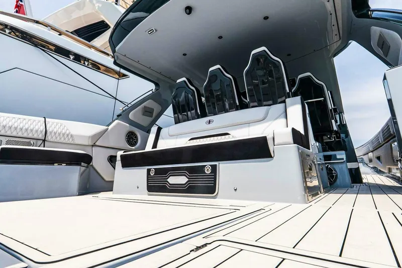 Slide: The Image of 2025 Cigarette 52' Thunder yacht interior with luxurious seating and sleek design. - 13