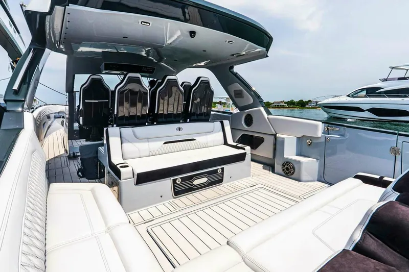 Slide: The Image of Luxurious interior of 2025 Cigarette 52' Thunder yacht with sleek seating and modern design. - 14