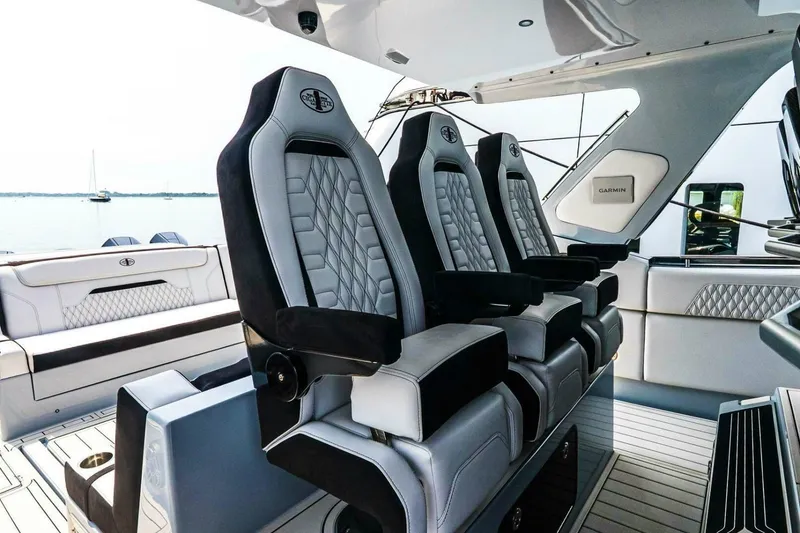 Slide: The Image of Luxury seating on 2025 Cigarette 52' Thunder boat, featuring sleek design and premium materials. - 19