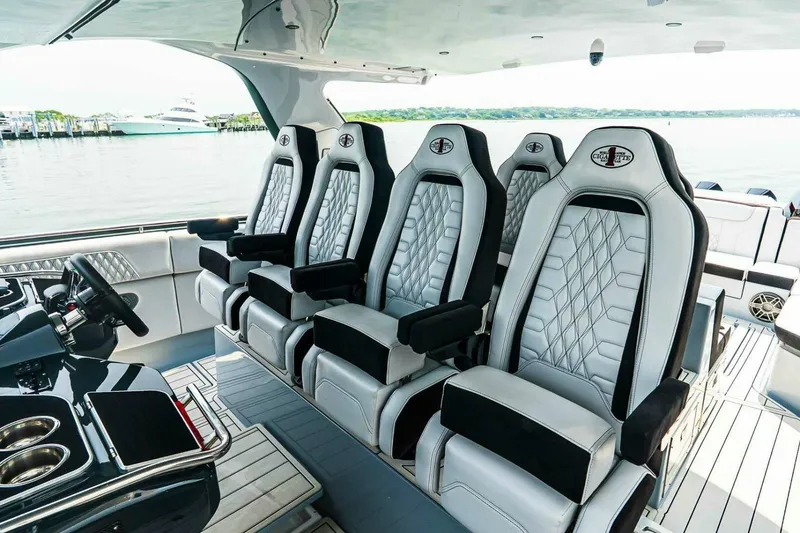 Slide: The Image of Luxurious seating on the 2025 Cigarette 52' Thunder boat, featuring sleek design and premium materials. - 22