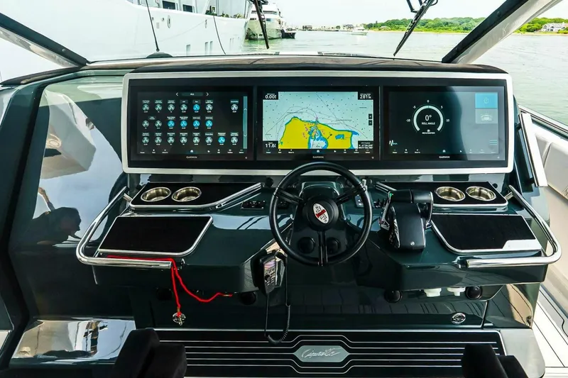 Slide: The Image of Helm of 2025 Cigarette 52' Thunder boat with advanced navigation displays. - 23