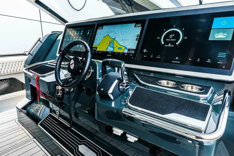 Slide: The Image of Helm of 2025 Cigarette 52' Thunder boat with advanced navigation displays. - 25