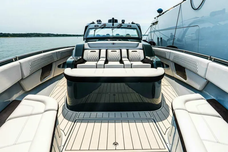 Slide: The Image of Luxurious 2025 Cigarette 52' Thunder yacht interior with plush seating and sleek design. - 32