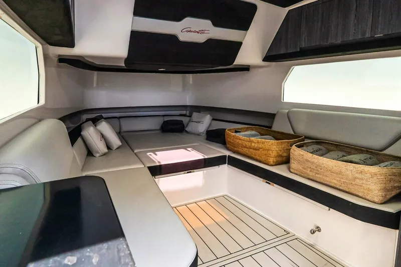 Slide: The Image of Luxurious interior of 2025 Cigarette 52' Thunder boat with seating and storage baskets. - 38