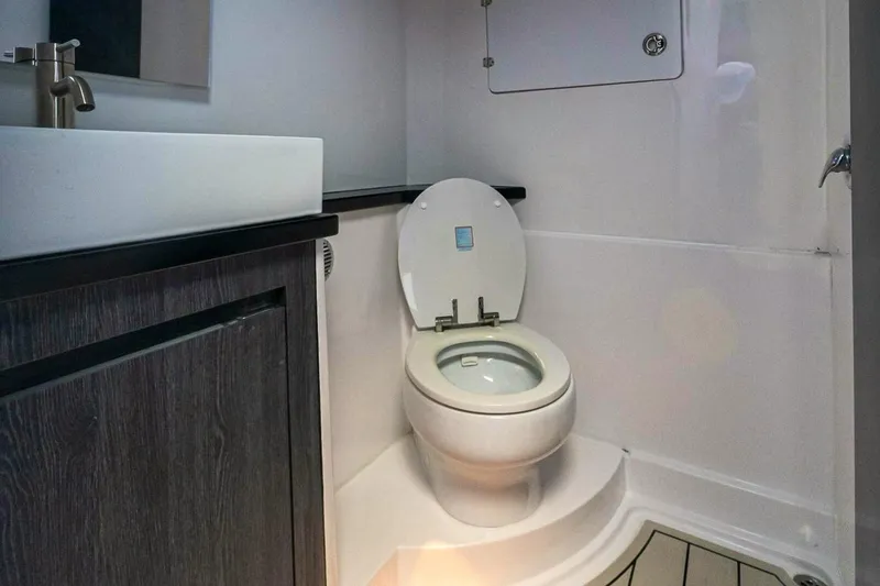 Slide: The Image of Modern bathroom interior in 2025 Cigarette 52' Thunder boat, featuring sleek design and fixtures. - 39