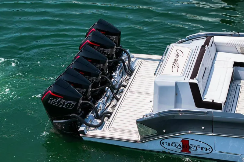 Slide: The Image of 2025 Cigarette 52' Thunder boat with multiple outboard engines on water. - 6