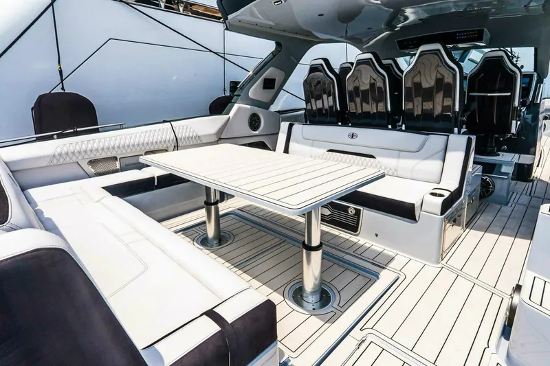 Slide: The Image of Luxurious interior of 2025 Cigarette 52' Thunder yacht with sleek seating and table. - 7