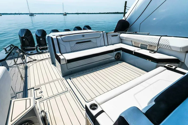 Slide: The Image of Luxurious 2025 Cigarette 52' Thunder yacht interior with sleek seating and powerful engines. - 9