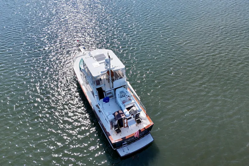 Slide: The Image of Aerial view of 1997 Sabre Sabreline 47 yacht on sparkling water. - 11