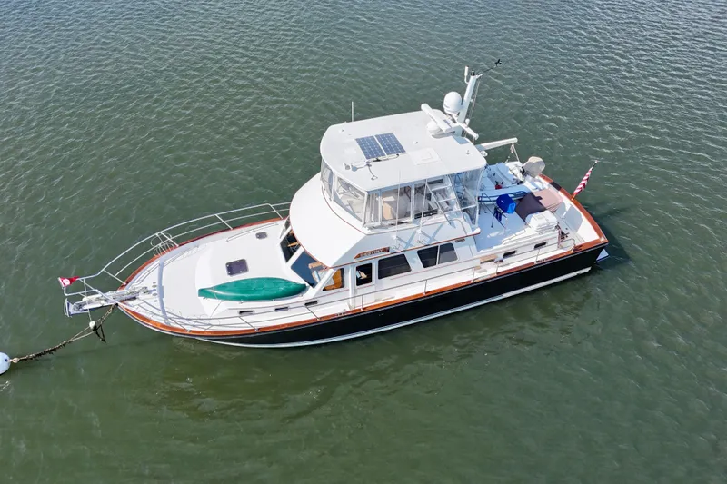 Slide: The Image of Aerial view of a 1997 Sabre Sabreline 47 yacht anchored on calm water. - 13