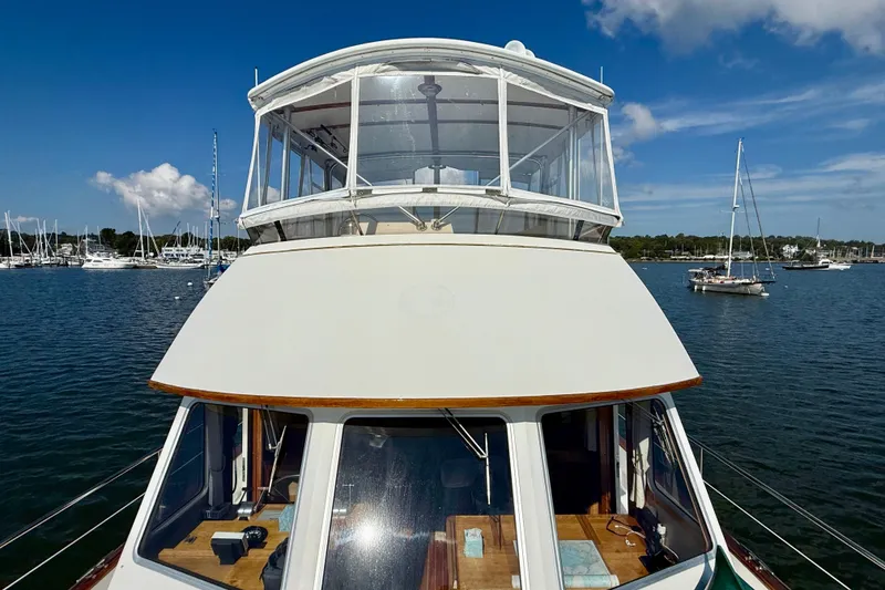 Slide: The Image of 1997 Sabre Sabreline 47 yacht on calm water with clear blue sky. - 20