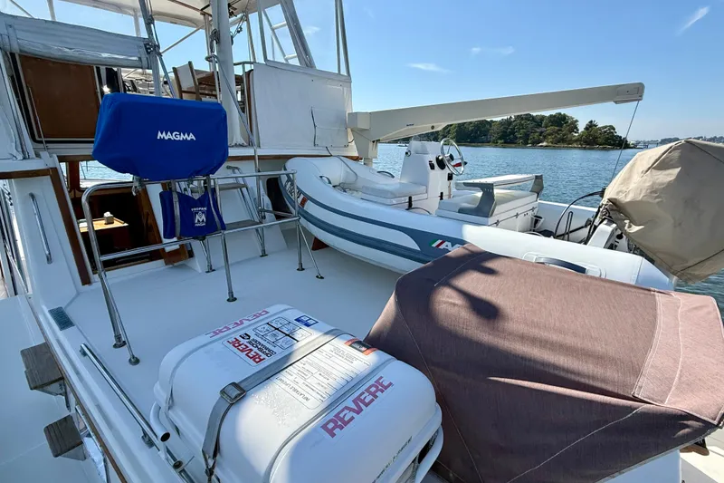 Slide: The Image of 1997 Sabre Sabreline 47 yacht deck with equipment and inflatable boat. - 29