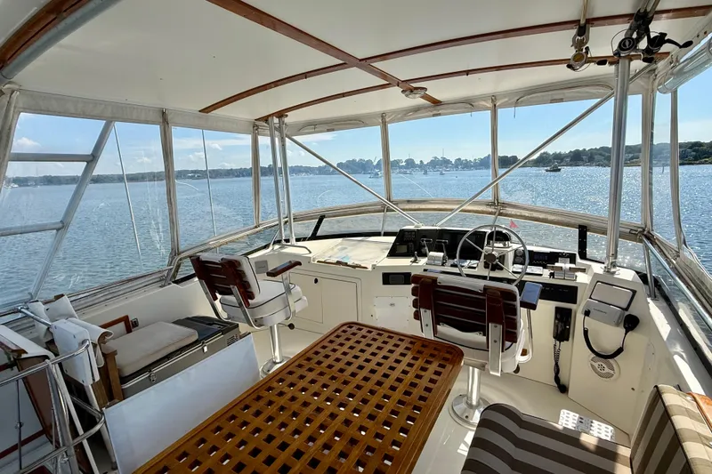 Slide: The Image of Interior view of 1997 Sabre Sabreline 47 yacht cockpit with steering wheel and seating. - 37