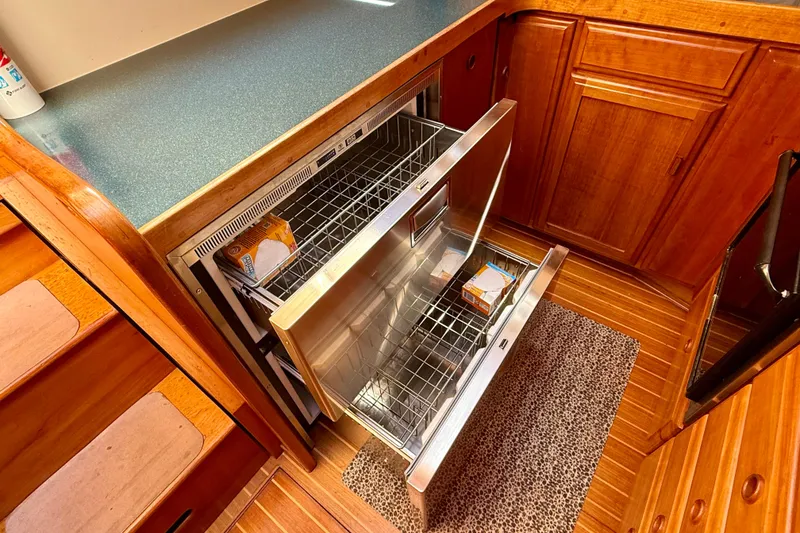 Slide: The Image of Galley of 1997 Sabre Sabreline 47 yacht with open stainless steel drawers. - 46