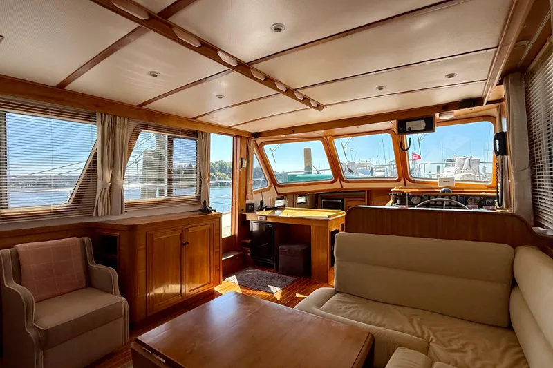 Slide: The Image of Interior of 1997 Sabre Sabreline 47 yacht with wood paneling and comfortable seating. - 57