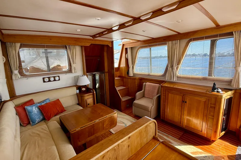 Slide: The Image of Luxurious 1997 Sabreline 47 yacht interior with elegant wood finishes and comfortable seating. - 62