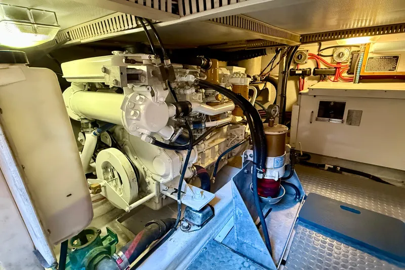 Slide: The Image of Engine room of a 1997 Sabre Sabreline 47 yacht, showcasing mechanical components. - 70