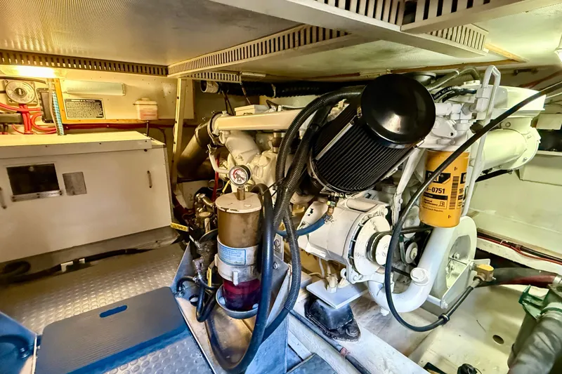 Slide: The Image of Engine room of 1997 Sabre Sabreline 47 yacht, showcasing mechanical components and equipment. - 72